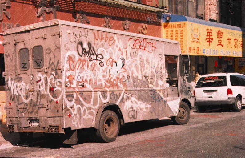 a van that is next to a white truck