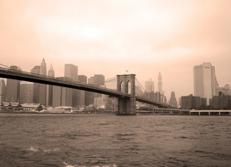 bridge with a city in the background as it is very foggy