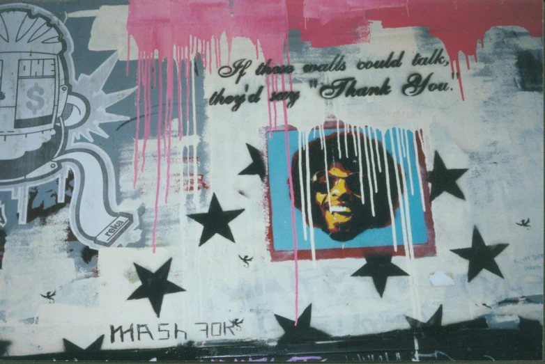 graffiti with stars and the caption of a black man with a mustache