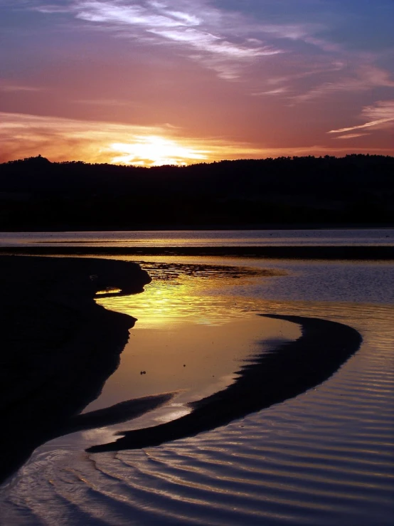 the sun shines brightly in the sky as it reflects on the water