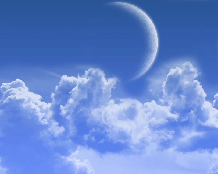 a partial moon is shown in the middle of a cloudy sky