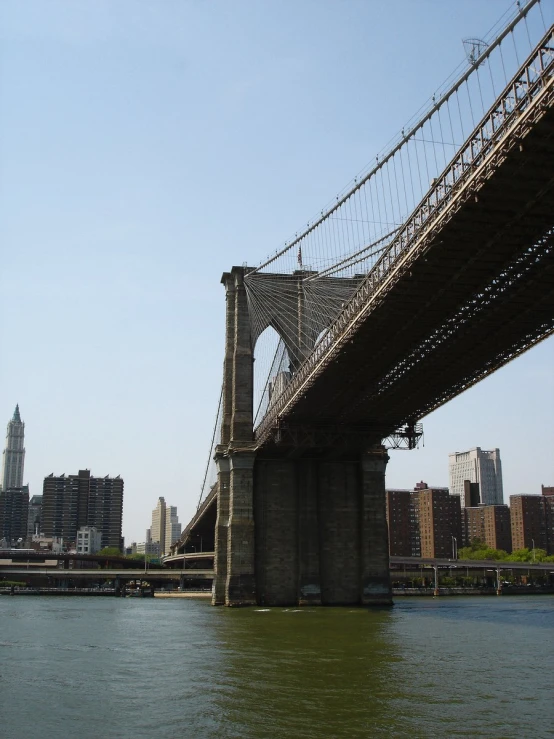 a bridge that is over the water with cars on it