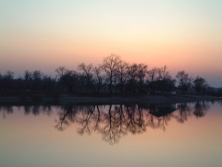 a sunset reflection in a body of water