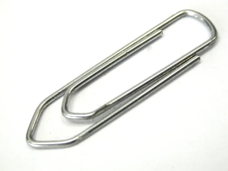 the end of a pair of silver metal paper clips