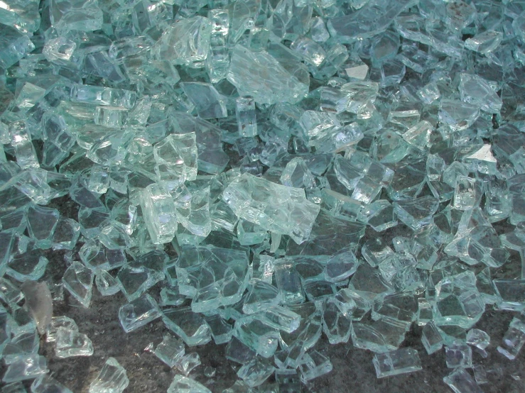 broken glass pieces piled together on the ground