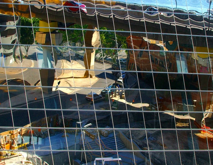 the mirror image of a boat is visible in the window