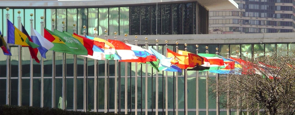 the flags of all countries are attached to a building