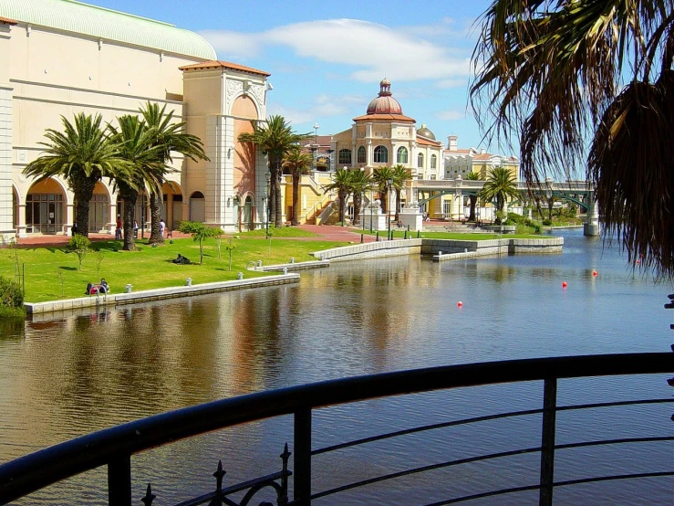 a canal lined with houses in the background