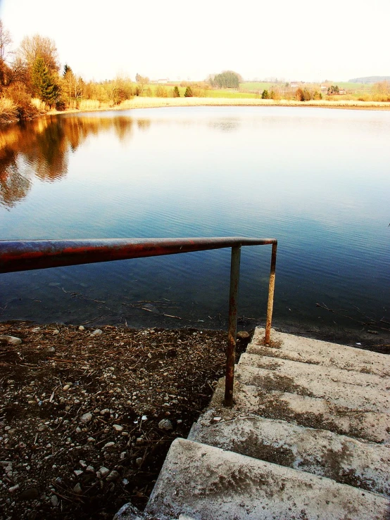 a staircase and a body of water at a lake