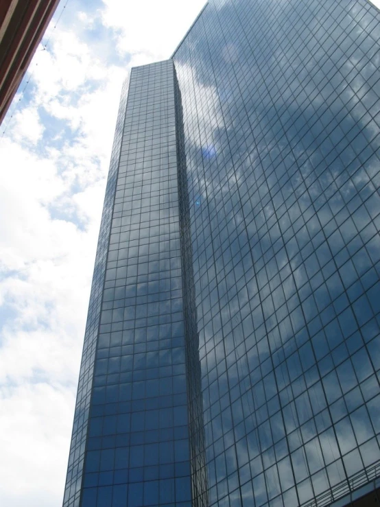 looking up at an office building that's glass