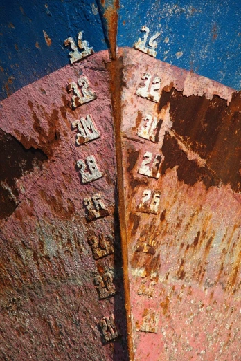 a rusted rusty corner with lots of writing on it
