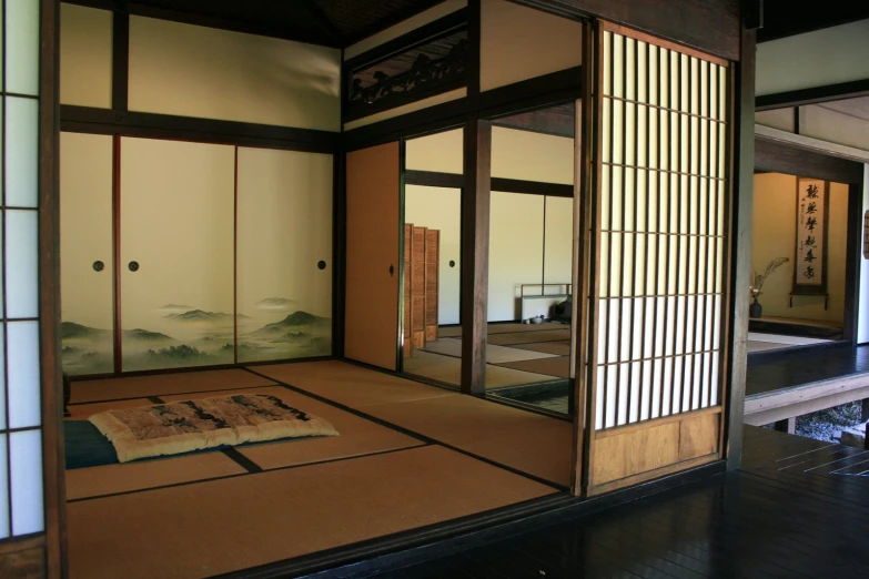 an oriental home with open doors leading to a bedroom