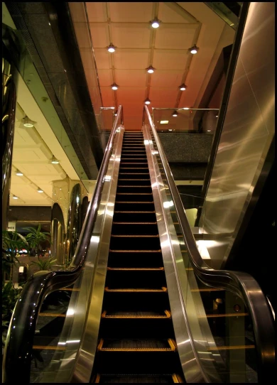 a escalator leading down in to a building