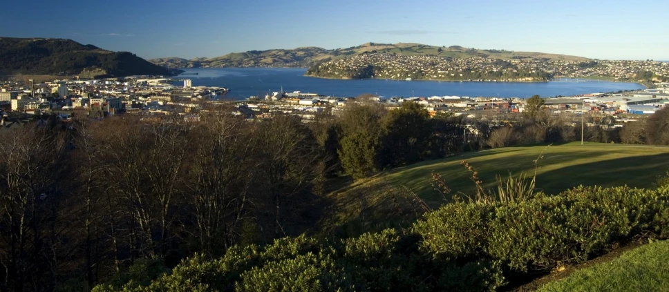 a panoramic view of an island town next to a lake