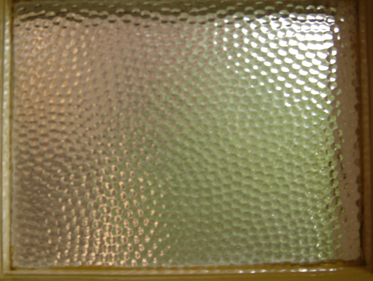 the inside of a glass window with dots on it