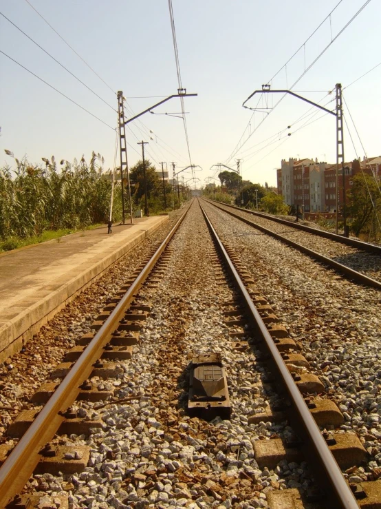 a train track running through the middle of some rural area