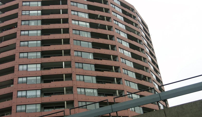 a large building that has windows near a street light