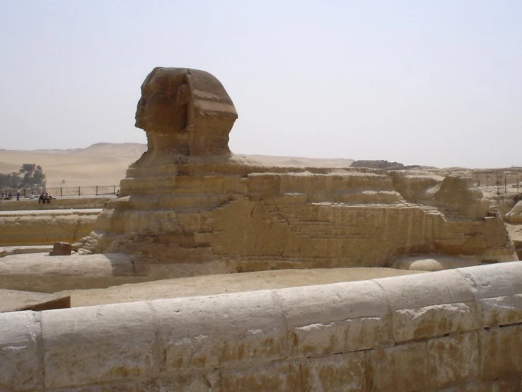 the sphinx head sits outside of a building