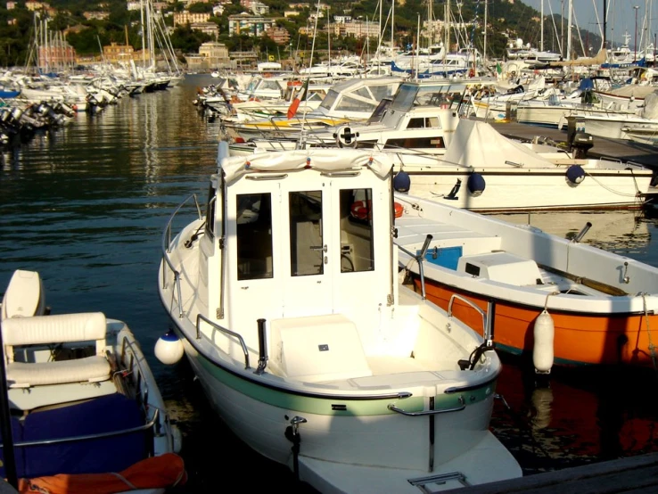 a group of boats docked at a pier