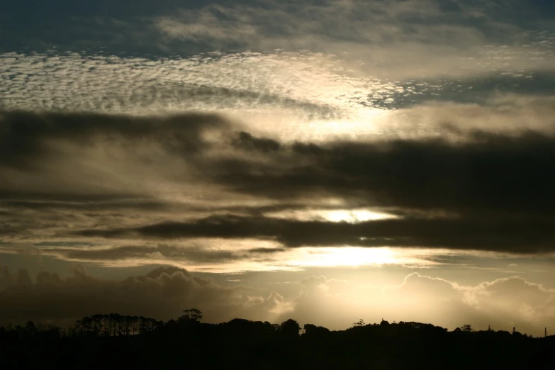 the sky is very dark with clouds over it