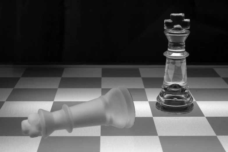 a black and white image of a chess piece