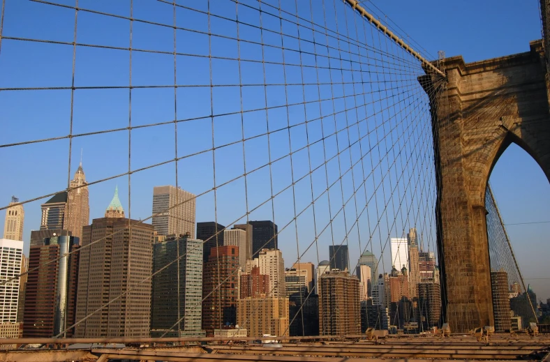 a view of the brooklyn bridge in the city