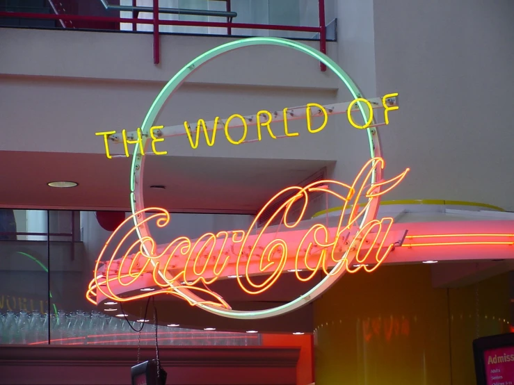 a neon sign that says the world of doughnuts