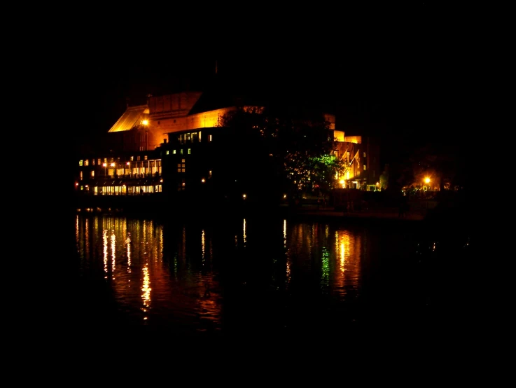 an image of a city lit up by buildings at night