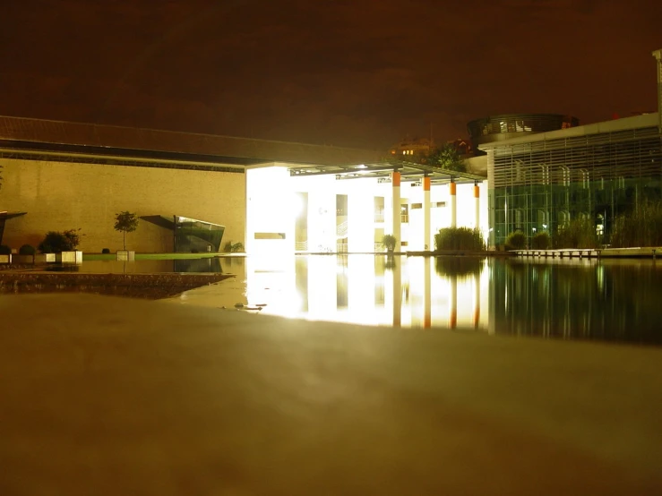 there is a dark building and water reflection