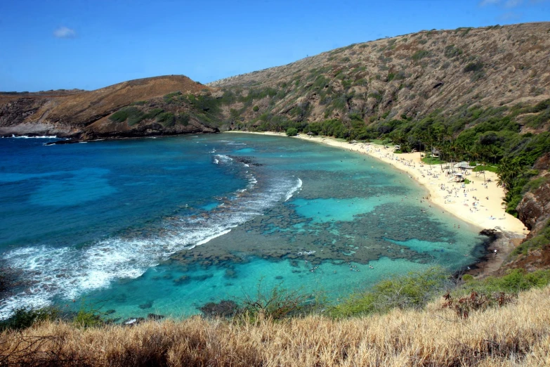 a very pretty and clear blue beach with lots of water