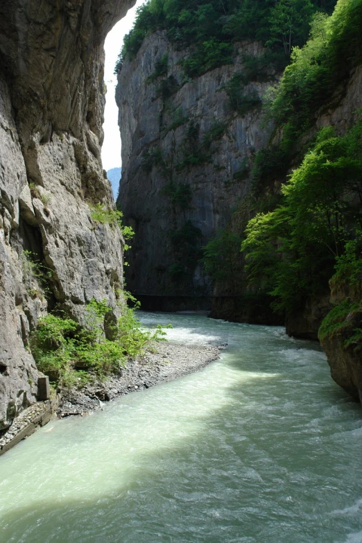 a view looking back over a river between two cliffs