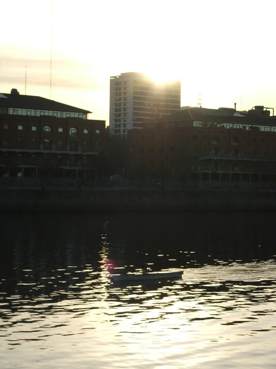 a city sits in the background next to some water