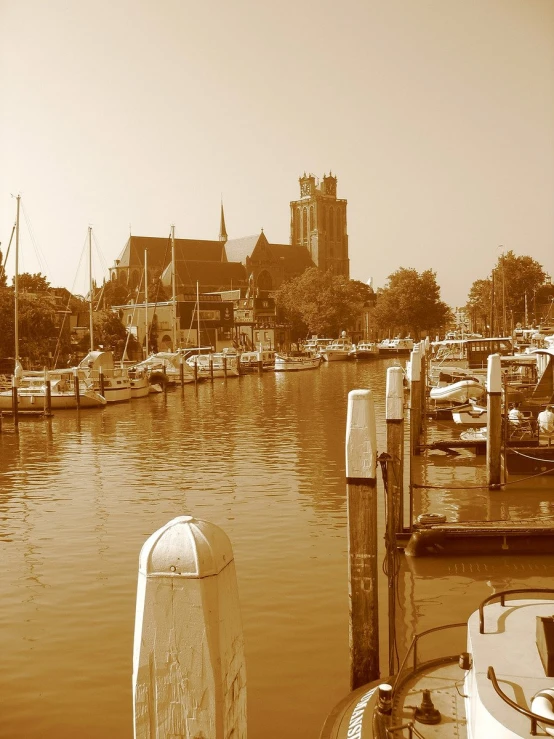 an old po of many boats docked at a marina