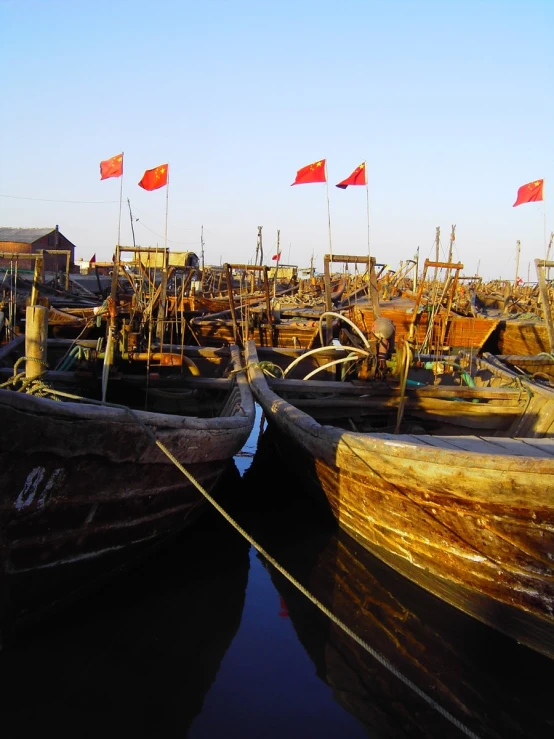 there are many fishing boats parked next to each other