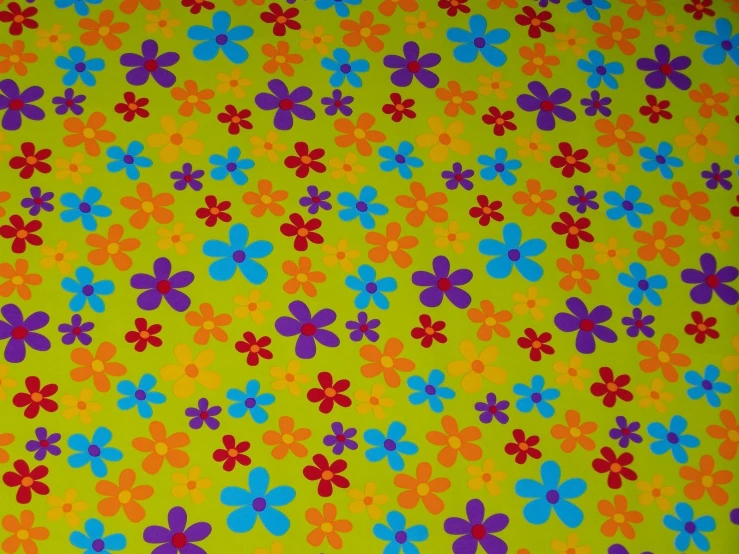 the fabric has flowers on green background