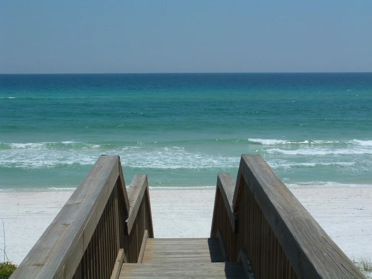 the steps down to the beach lead up to the ocean