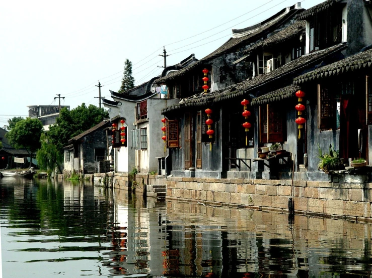 some buildings and water in front of a building