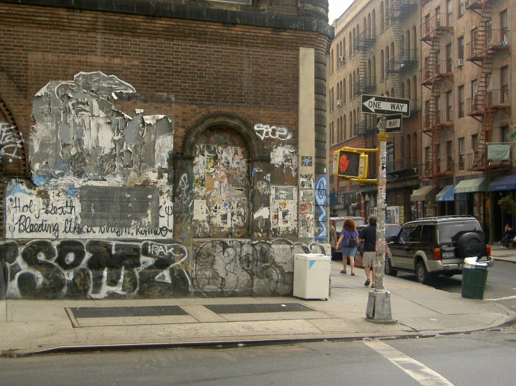 a large stone wall has been adorned with graffiti