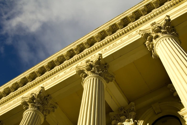 a group of pillars are near a building