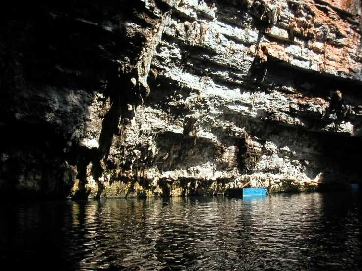 a view from the water at some mountains and water