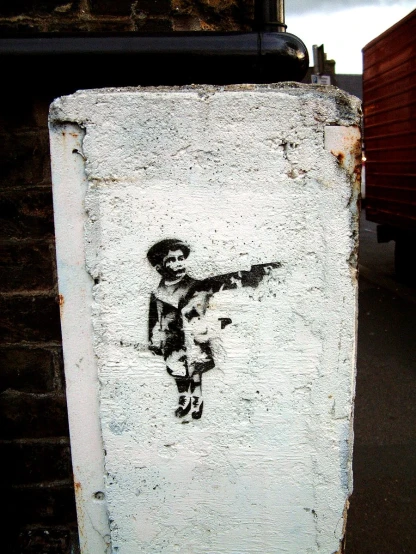 the sticker shows an image of a child holding a gun