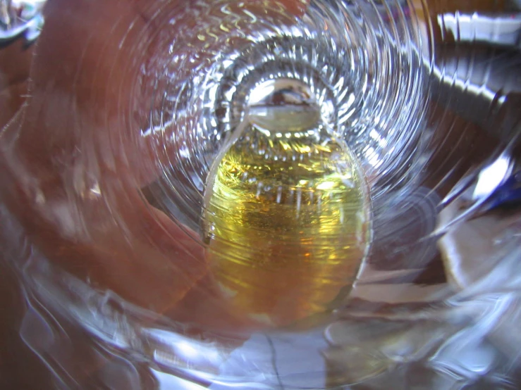 a large yellow object inside of a glass plate