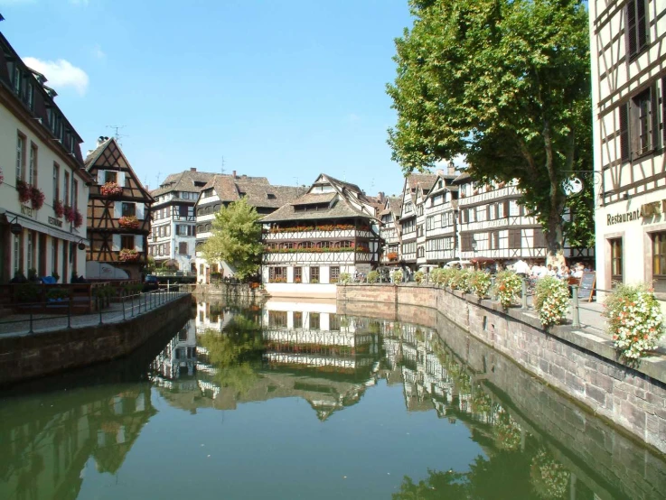 a canal running between buildings along the sides