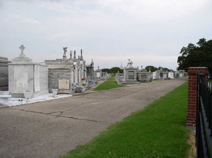 a graveyard in a cemetery with many graves
