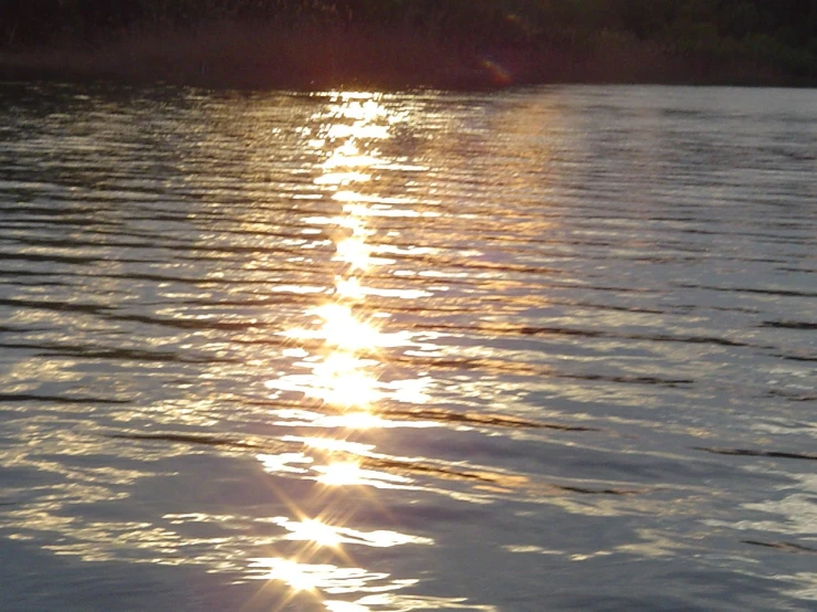 a body of water that has some reflections on it