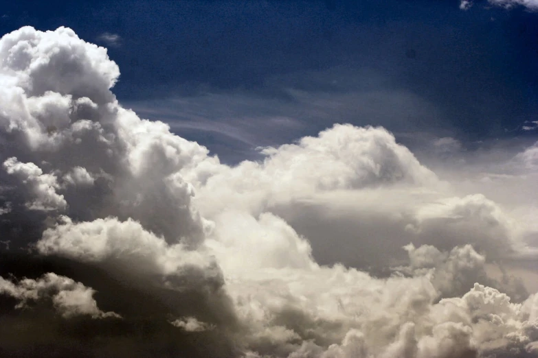 several fluffy clouds with no rain and blue sky