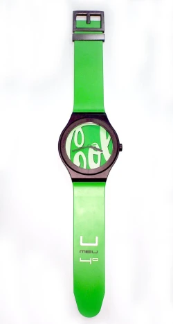 a green watch with an arabic name and a red face