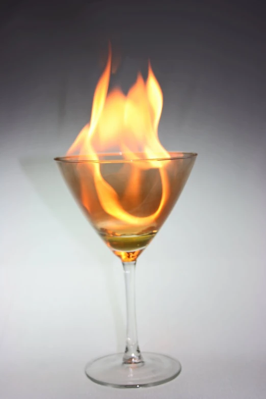 a glass of water filled with flames