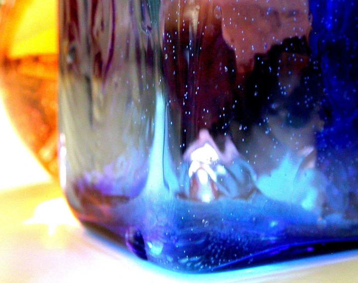 closeup of the glass inside a clear blue jar