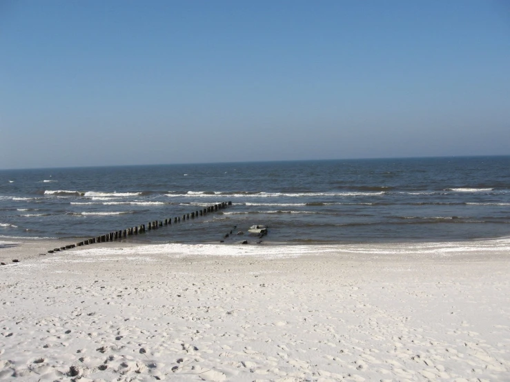 a white sandy beach filled with small waves